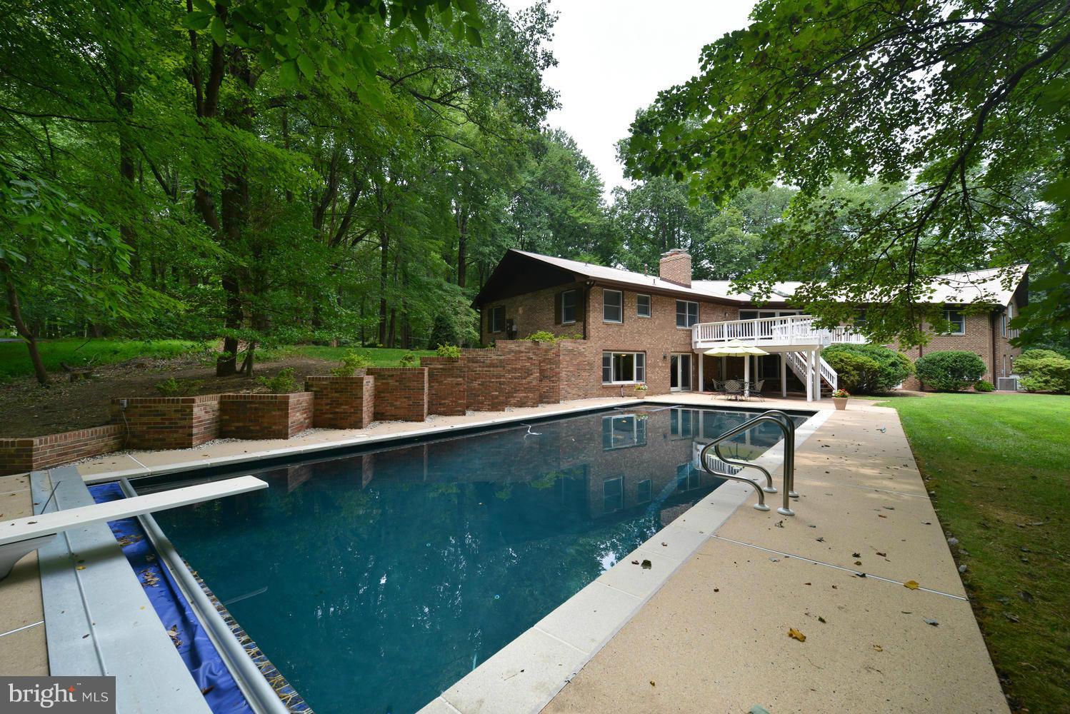 243 Springvale Road Great Falls, VA 22066 - Photo 26 of 30 a front view of a house with a yard