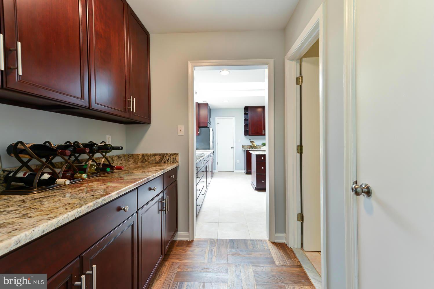 243 Springvale Road Great Falls, VA 22066 - Photo 9 of 30 a kitchen with a sink and cabinets