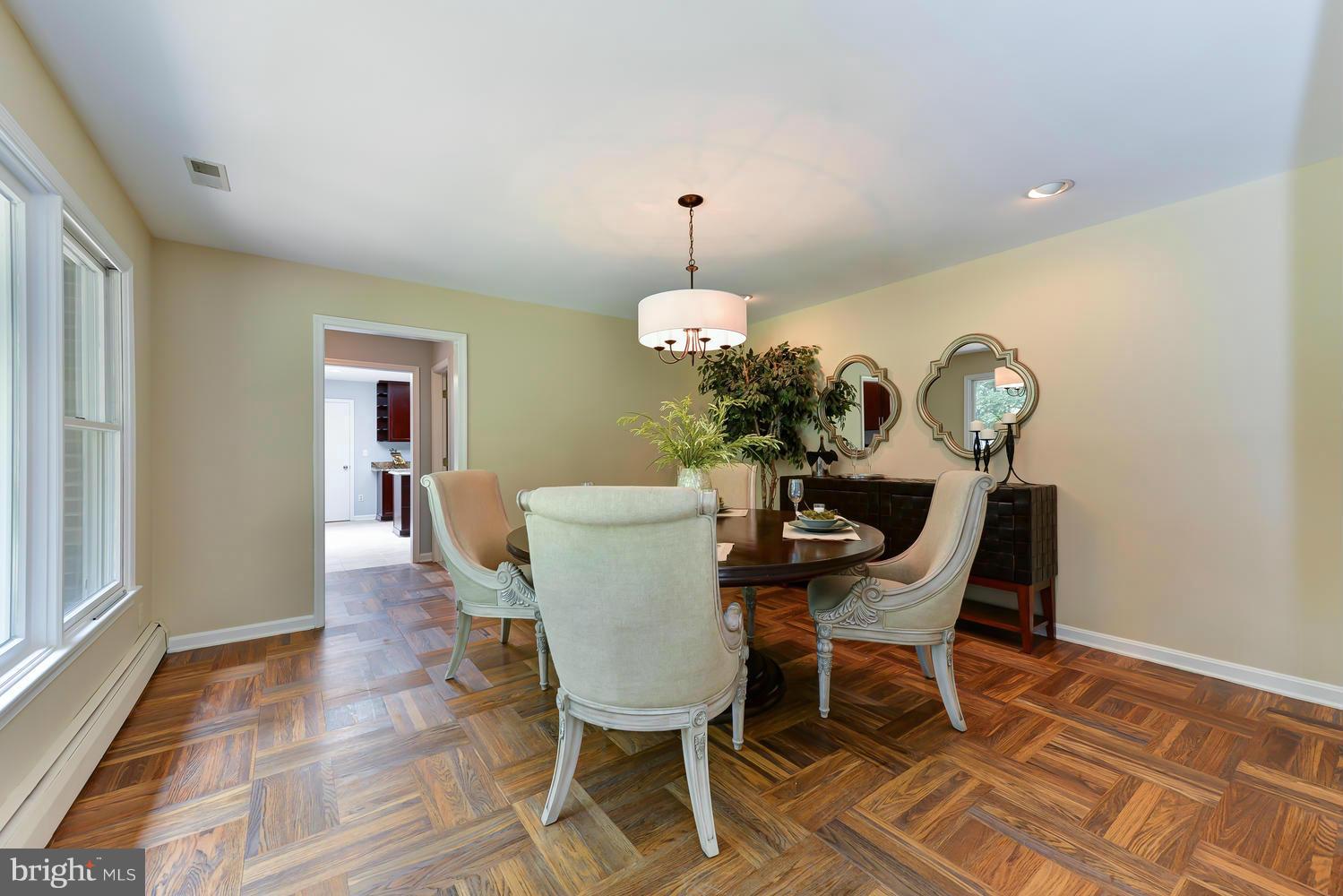 243 Springvale Road Great Falls, VA 22066 - Photo 10 of 30 a dining room with furniture and wooden floor