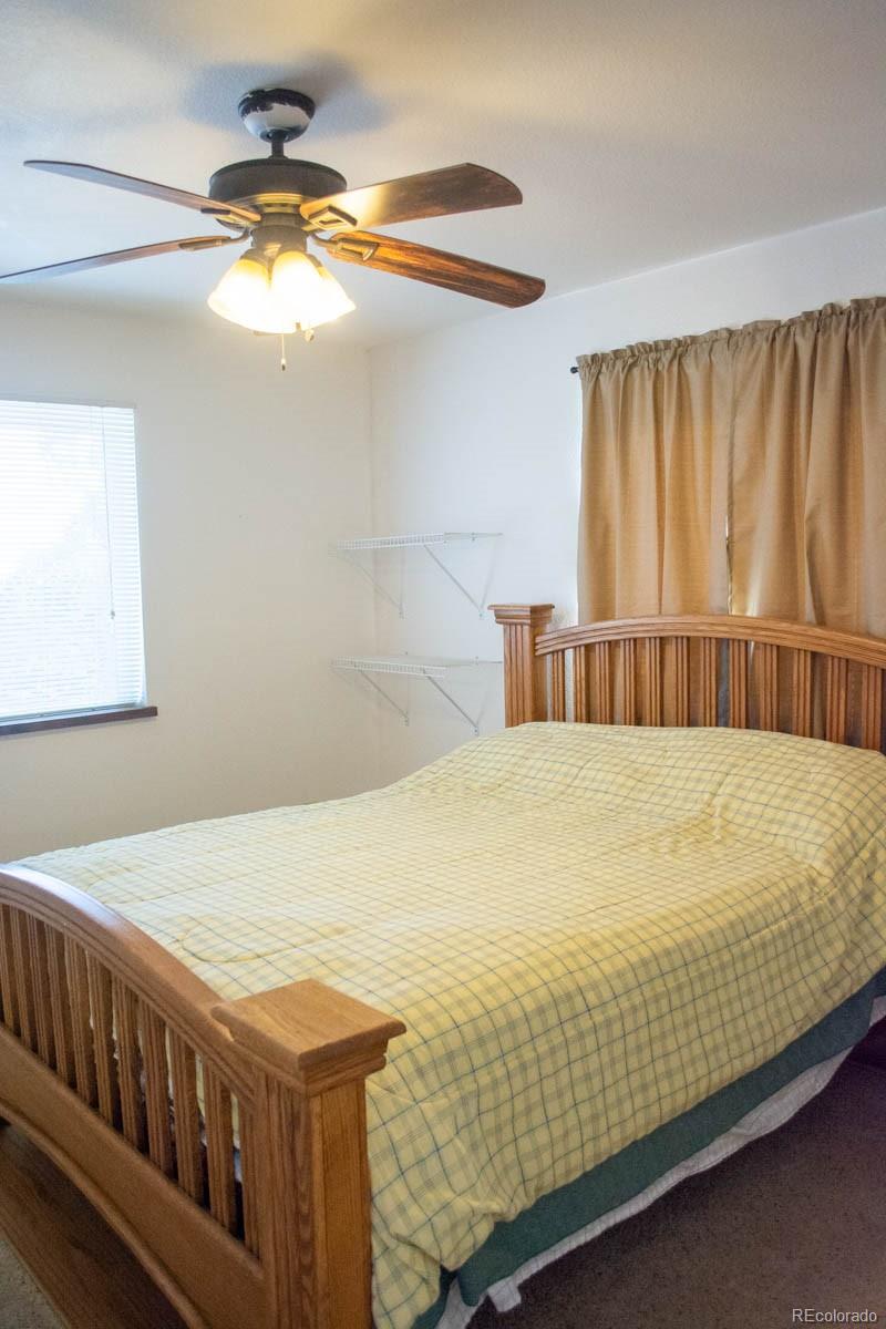 291 Turkey Ridge Road Walsenburg, CO 81089 - Photo 15 of 40 a bed sitting in a bedroom next to a window