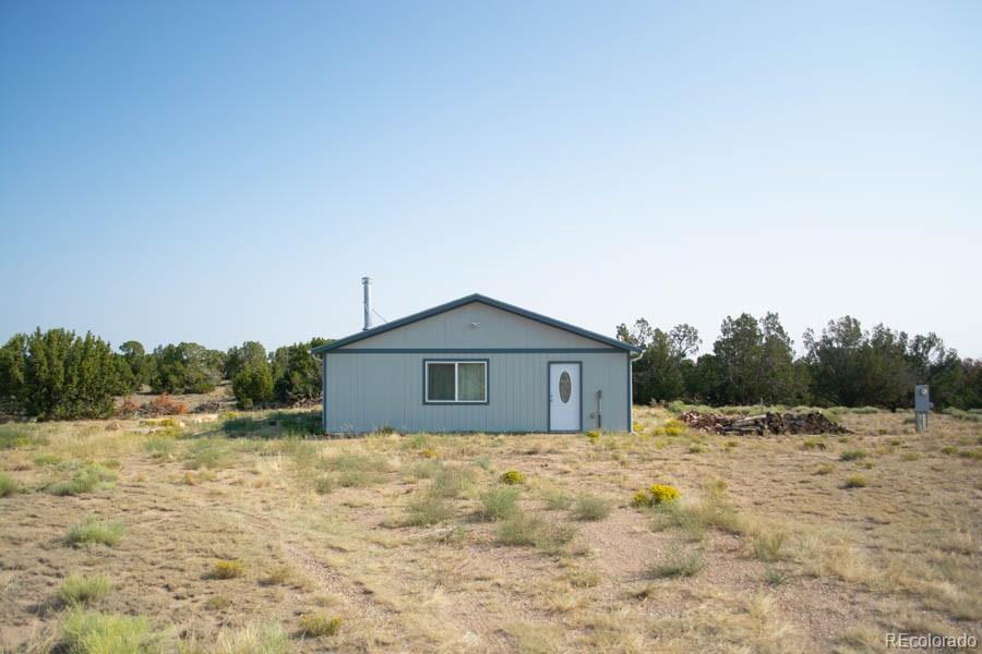 291 Turkey Ridge Road Walsenburg, CO 81089 - Photo 22 of 40 a big house with a big yard and large tree
