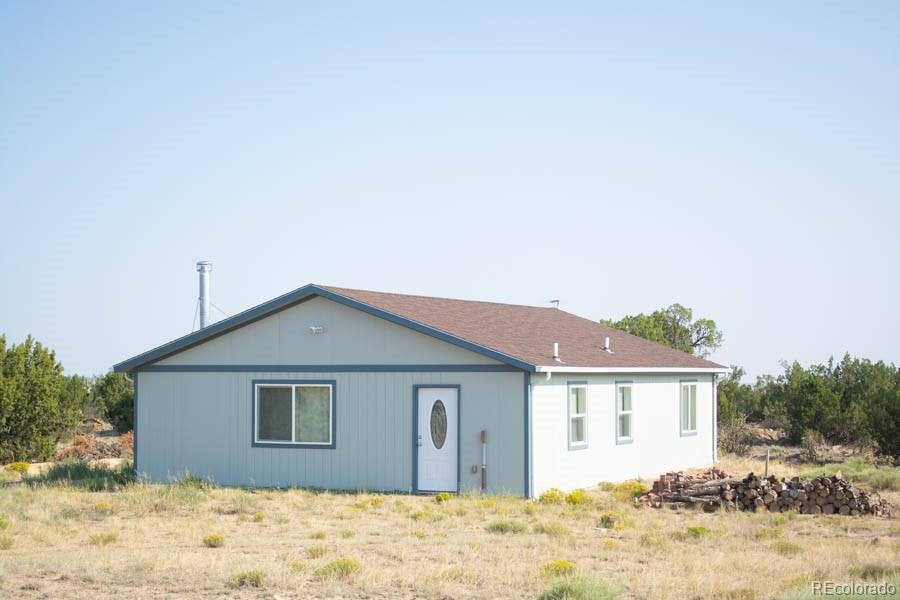 291 Turkey Ridge Road Walsenburg, CO 81089 - Photo 23 of 40 a front view of a house with a yard