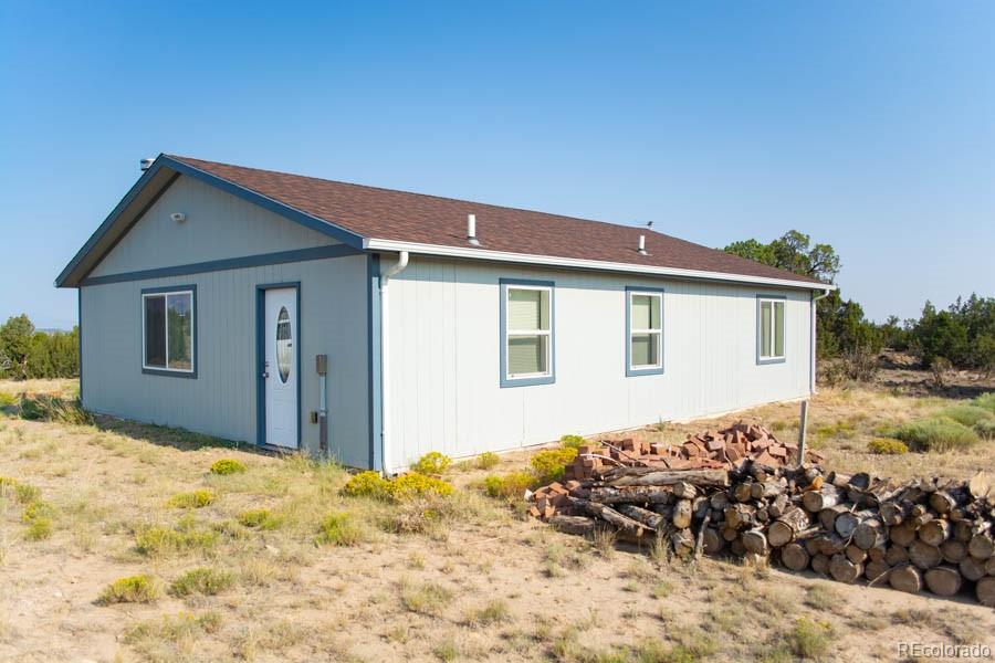 291 Turkey Ridge Road Walsenburg, CO 81089 - Photo 27 of 40 a view of a house with a yard