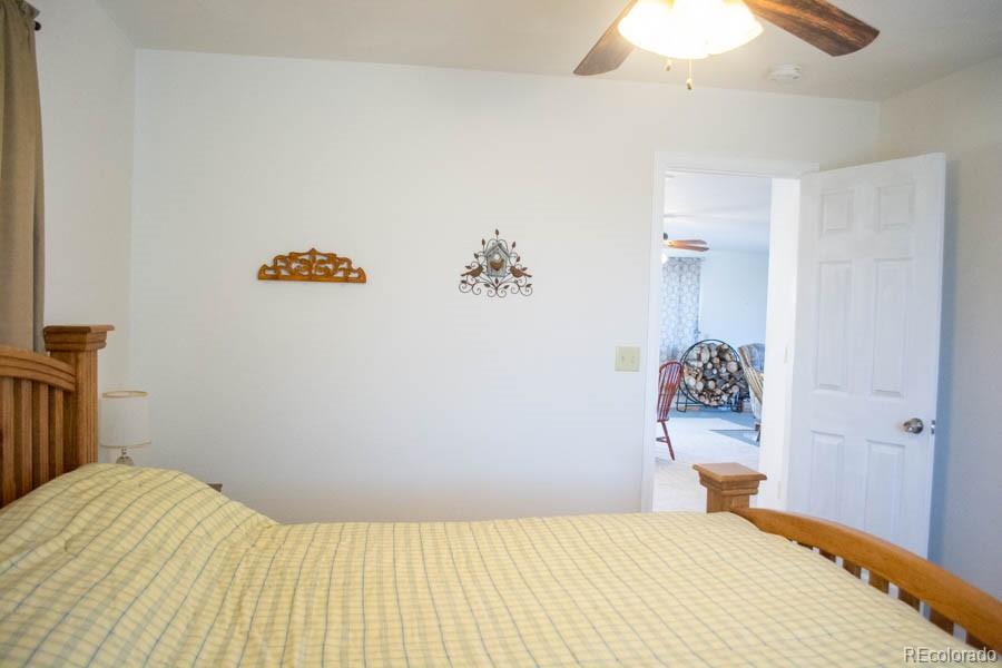 291 Turkey Ridge Road Walsenburg, CO 81089 - Photo 30 of 40 a bedroom with a bed and a table