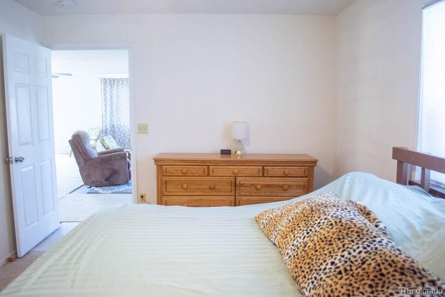 291 Turkey Ridge Road Walsenburg, CO 81089 - Photo 35 of 40 a bedroom with a bed and a dresser