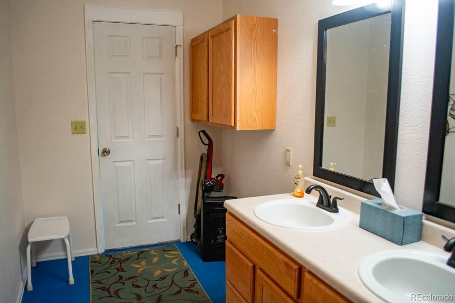 291 Turkey Ridge Road Walsenburg, CO 81089 - Photo 38 of 40 a bathroom with a sink and a mirror