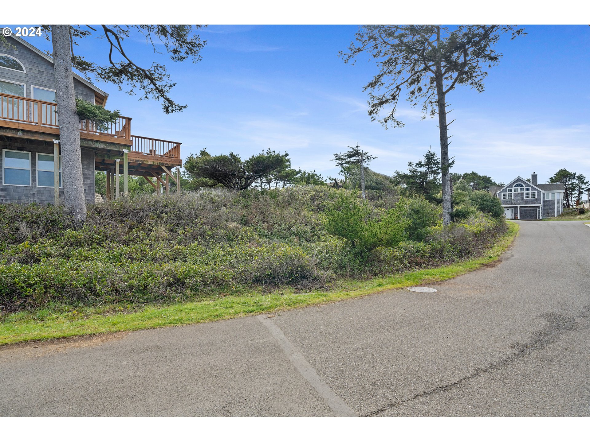 Tobin Lane, Unit TL 9800 Manzanita, OR 97130 - Photo 5 of 10 a view of a street with a houses