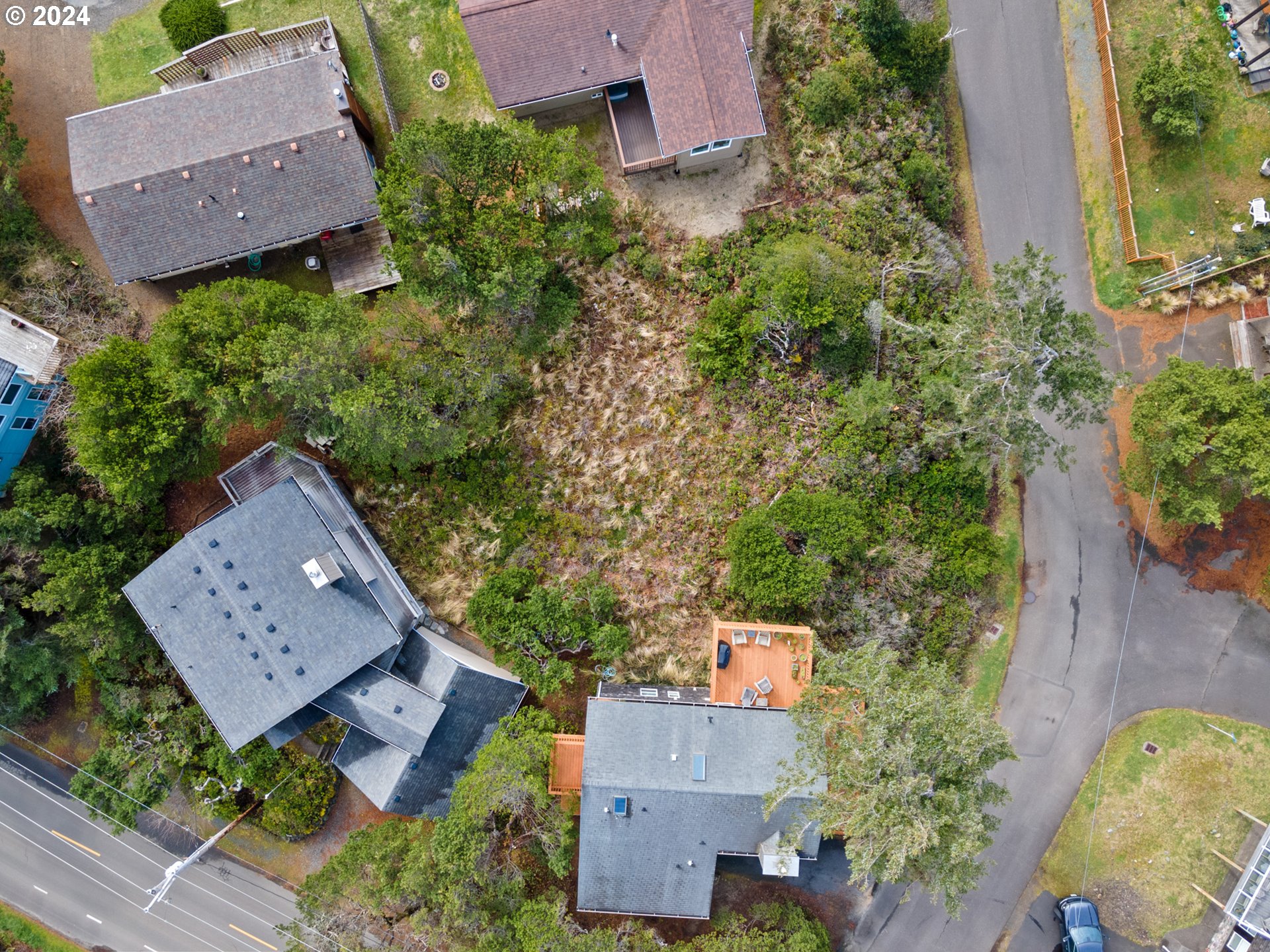 Tobin Lane, Unit TL 9800 Manzanita, OR 97130 - Photo 6 of 10 an aerial view of a house with garden space and a street view