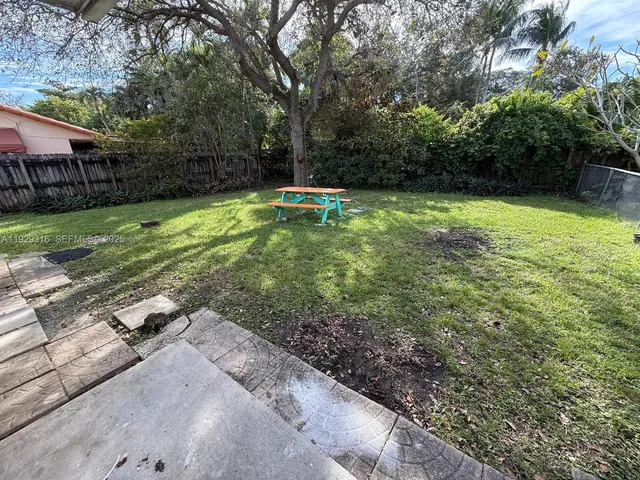 a view of a backyard with a garden