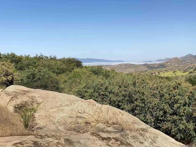 a view of a lake with mountains in the background