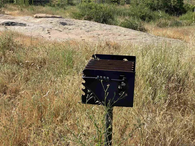 a view of a porch with furniture and a yard