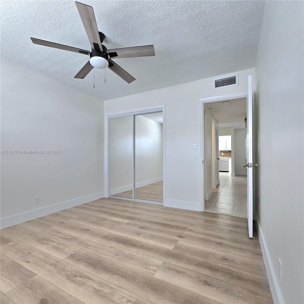 5300 Washington Street, Unit I205 Hollywood, FL 33021 - Photo 11 of 20 a view of empty room with wooden floor