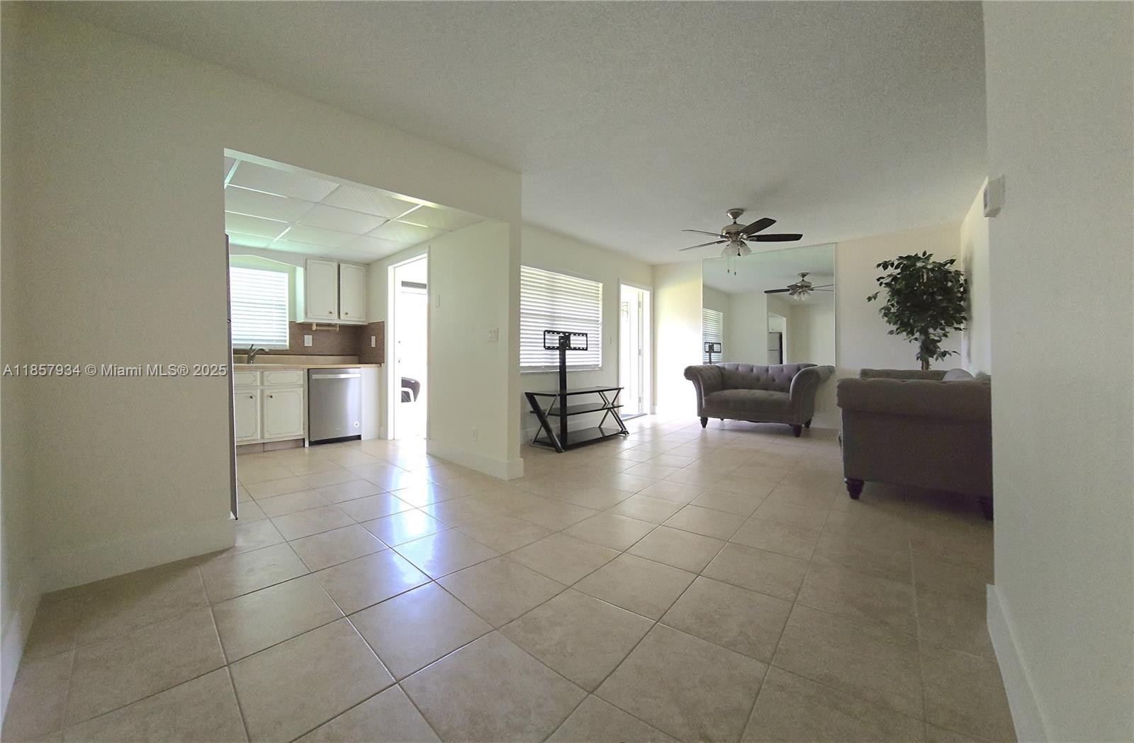 5300 Washington Street, Unit I205 Hollywood, FL 33021 - Photo 6 of 20 a open kitchen with cabinets and stainless steel appliances