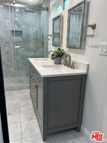 a bedroom with a bed and a table