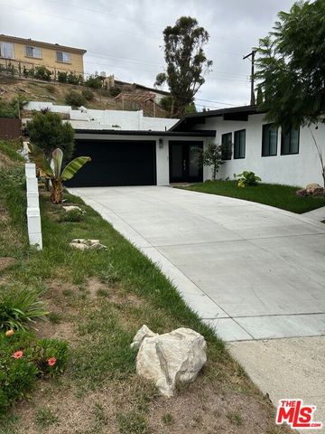 a bathroom with a sink a shower and a mirror