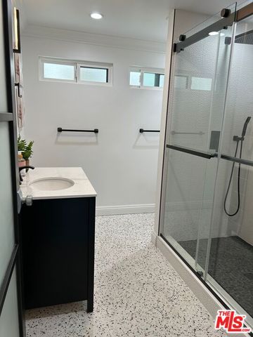 a bathroom with a tub and a shower