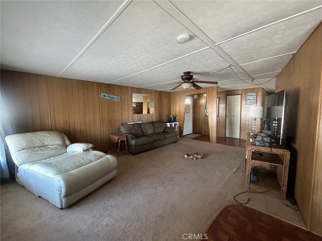 210 Ward Avenue Ridgecrest, CA 93555 - Photo 16 of 19 a living room with furniture and a mirror