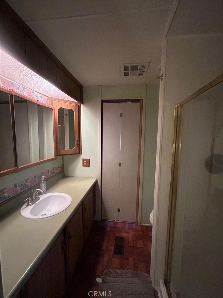 210 Ward Avenue Ridgecrest, CA 93555 - Photo 9 of 19 a bathroom with a sink and a mirror