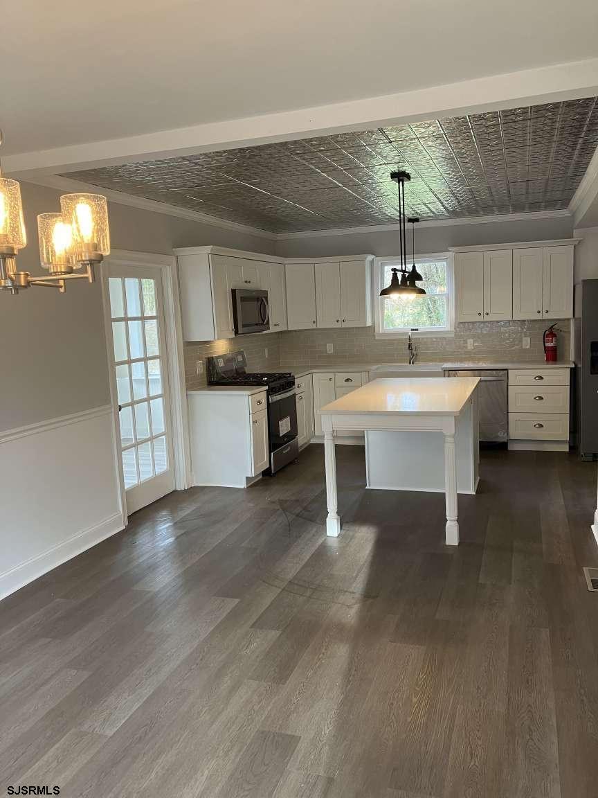 23 Leeds Point Road Galloway Township, NJ 08205 - Photo 7 of 23 a view of a kitchen with a sink a counter space and appliances