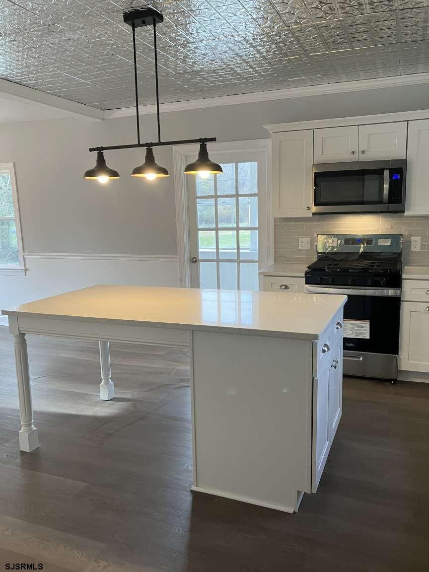 23 Leeds Point Road Galloway Township, NJ 08205 - Photo 8 of 23 a kitchen with a sink cabinets and appliances