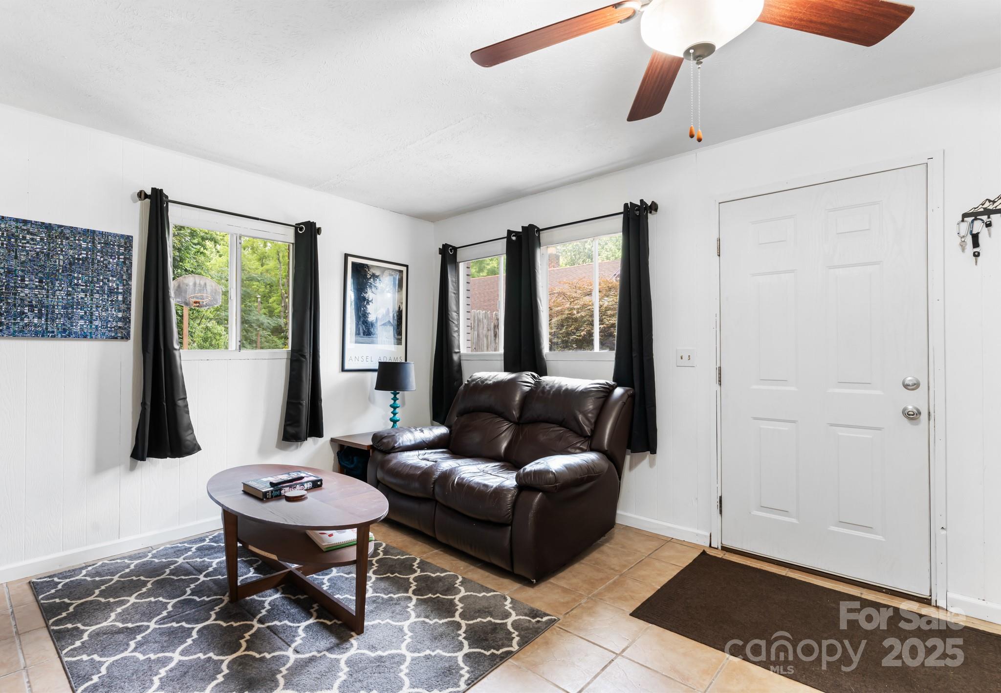 245 Hookers Gap Road Candler, NC 28715 - Photo 19 of 44 a living room with furniture and a window
