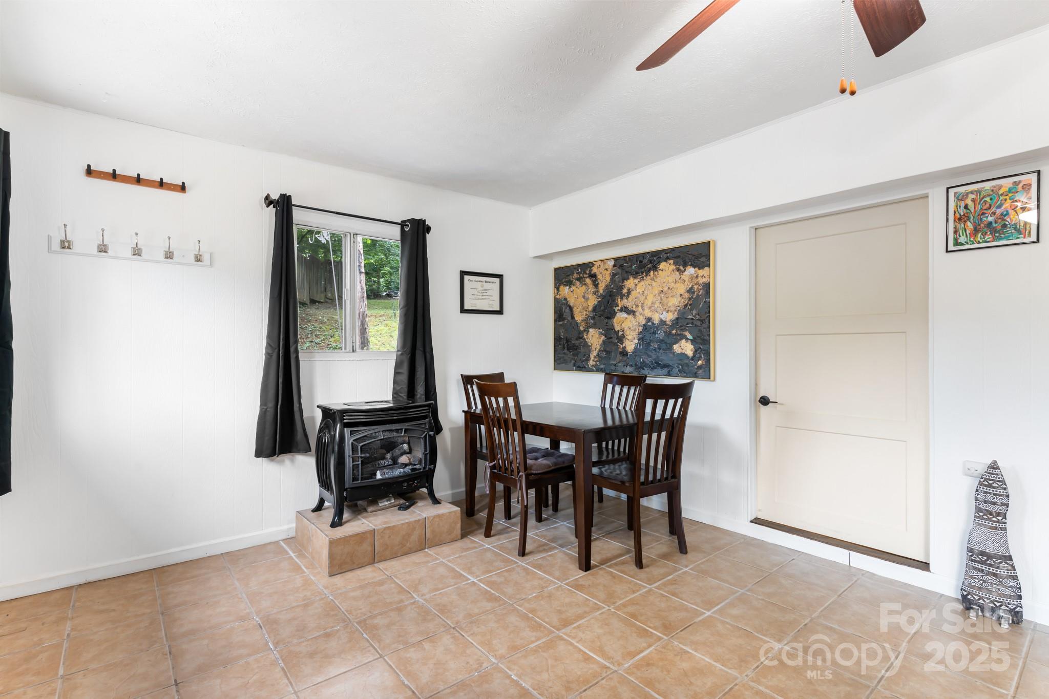 245 Hookers Gap Road Candler, NC 28715 - Photo 21 of 44 a view of a dining room with furniture window and outside view
