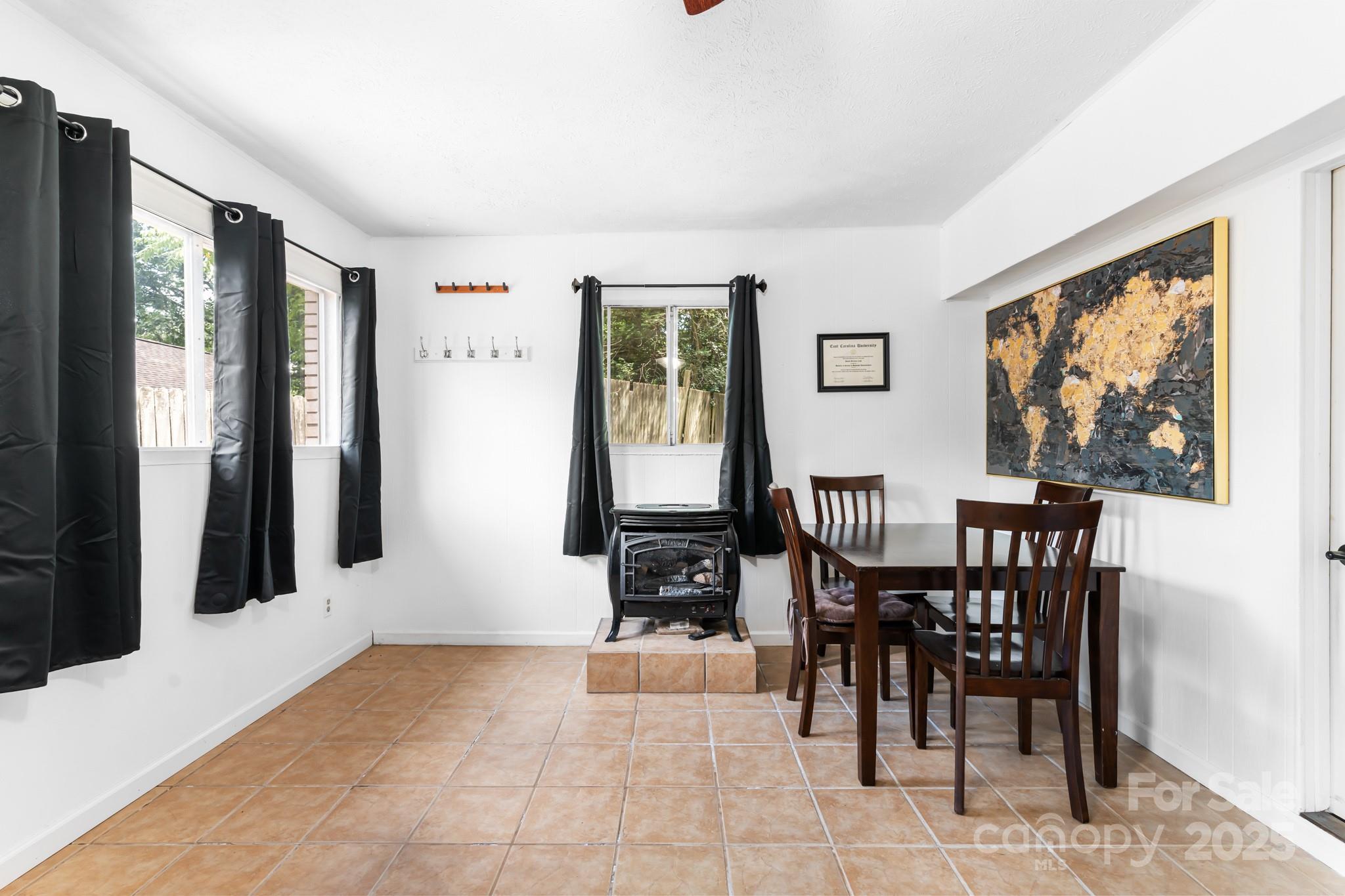 245 Hookers Gap Road Candler, NC 28715 - Photo 23 of 44 a view of a dining room with furniture window and outside view