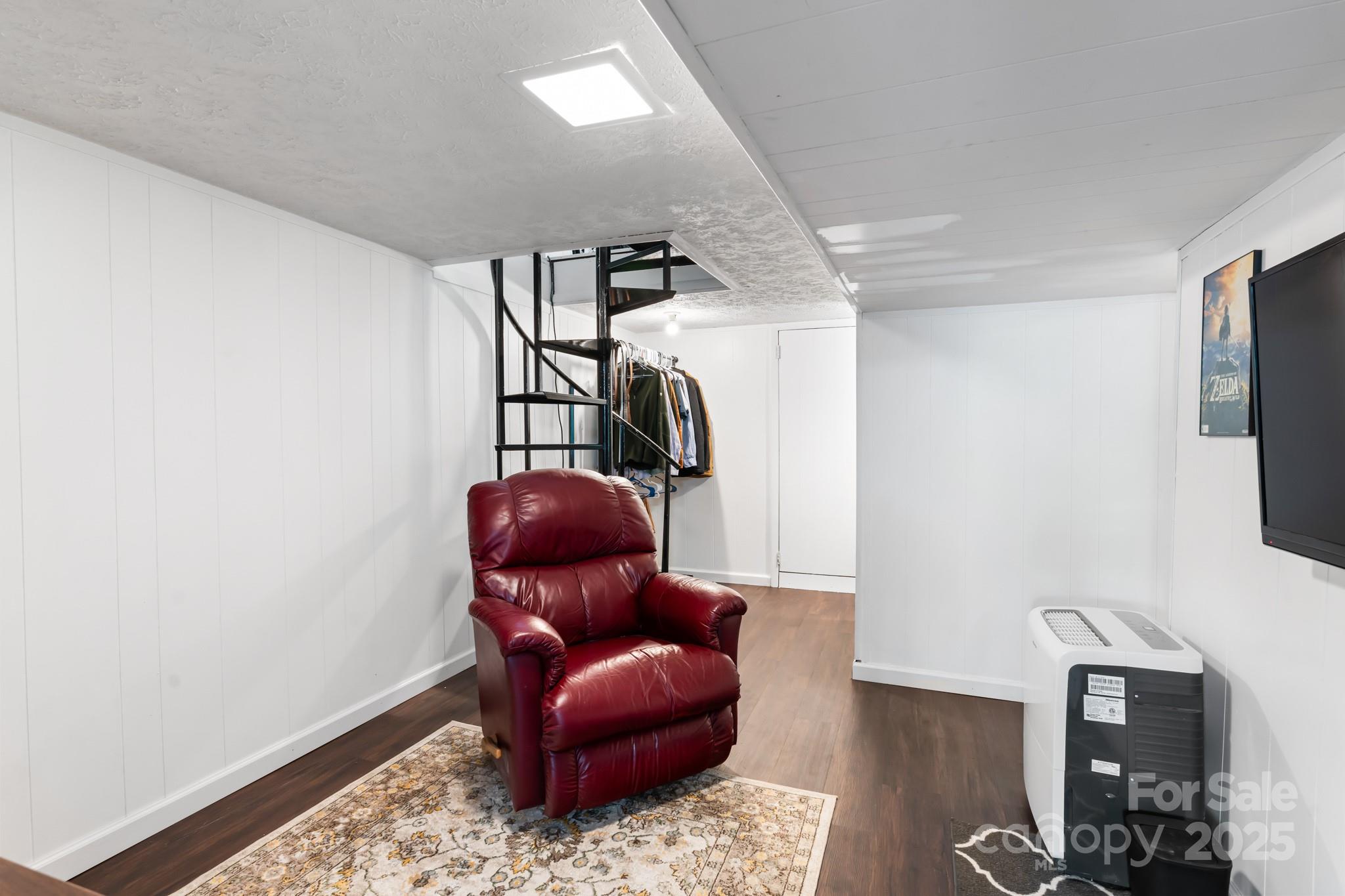 245 Hookers Gap Road Candler, NC 28715 - Photo 28 of 44 a view of living room with furniture and wooden floor