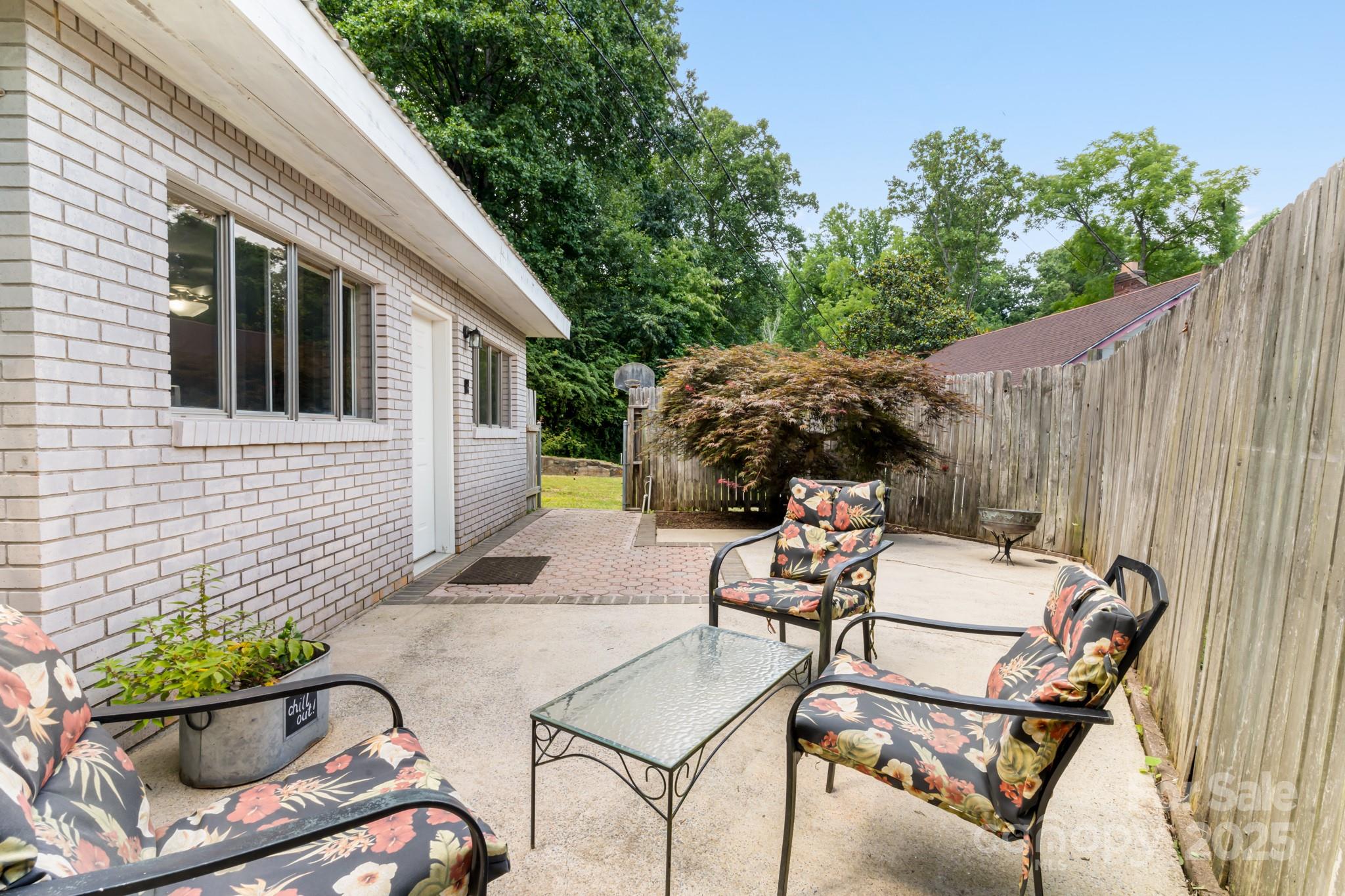 245 Hookers Gap Road Candler, NC 28715 - Photo 5 of 44 a view of backyard with outdoor seating and plants