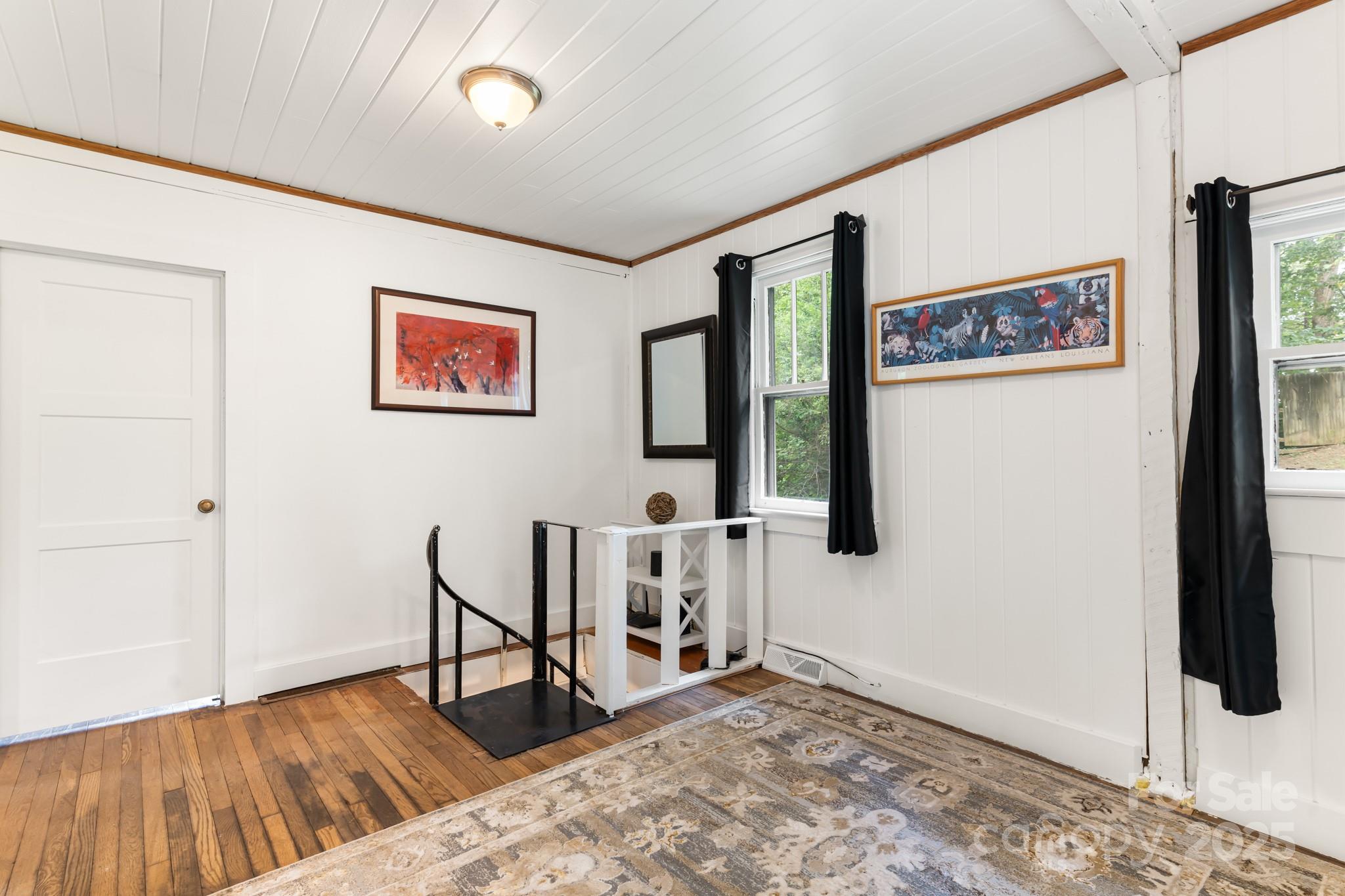 245 Hookers Gap Road Candler, NC 28715 - Photo 9 of 44 a view of a livingroom with wooden floor and furniture