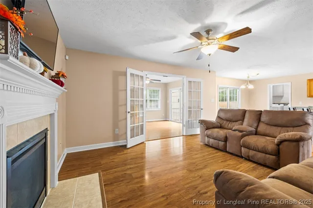 a living room with furniture and a fireplace