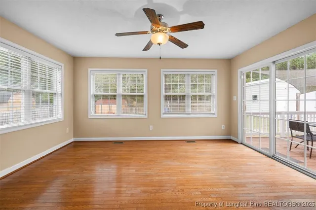 a view of an empty room with glass windows and a floor to ceiling window