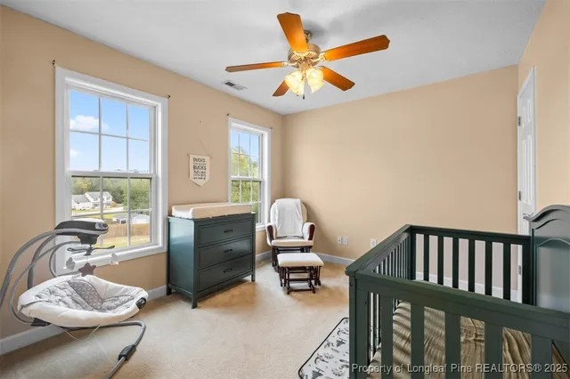 a bedroom with furniture and a window