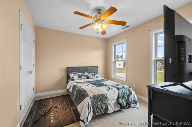 a bedroom with a bed and window