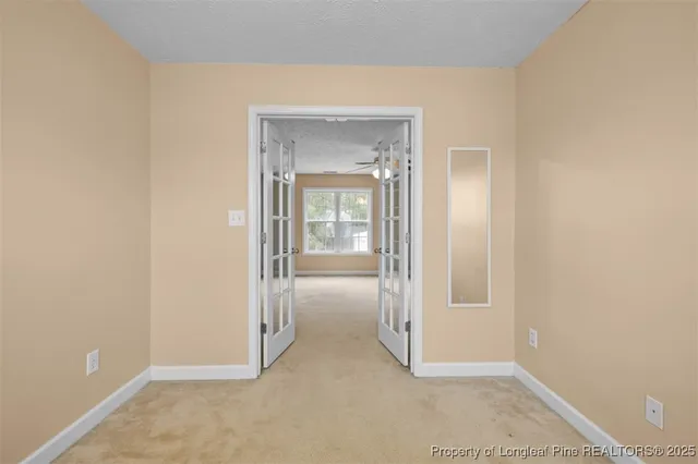 an empty room with mirror