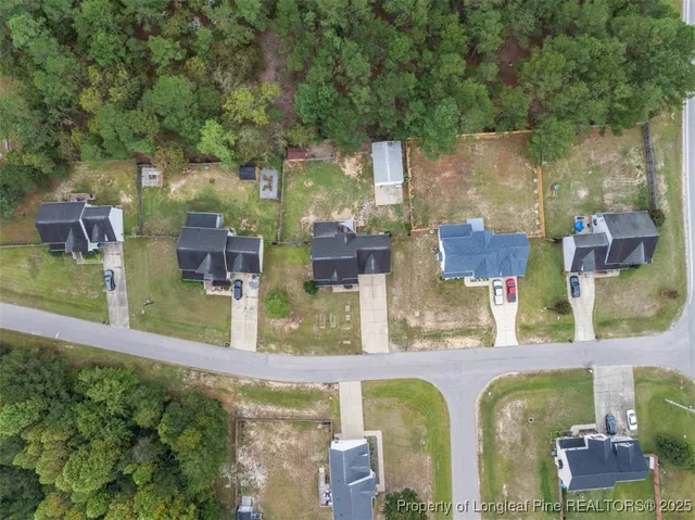 an aerial view of a houses with outdoor space