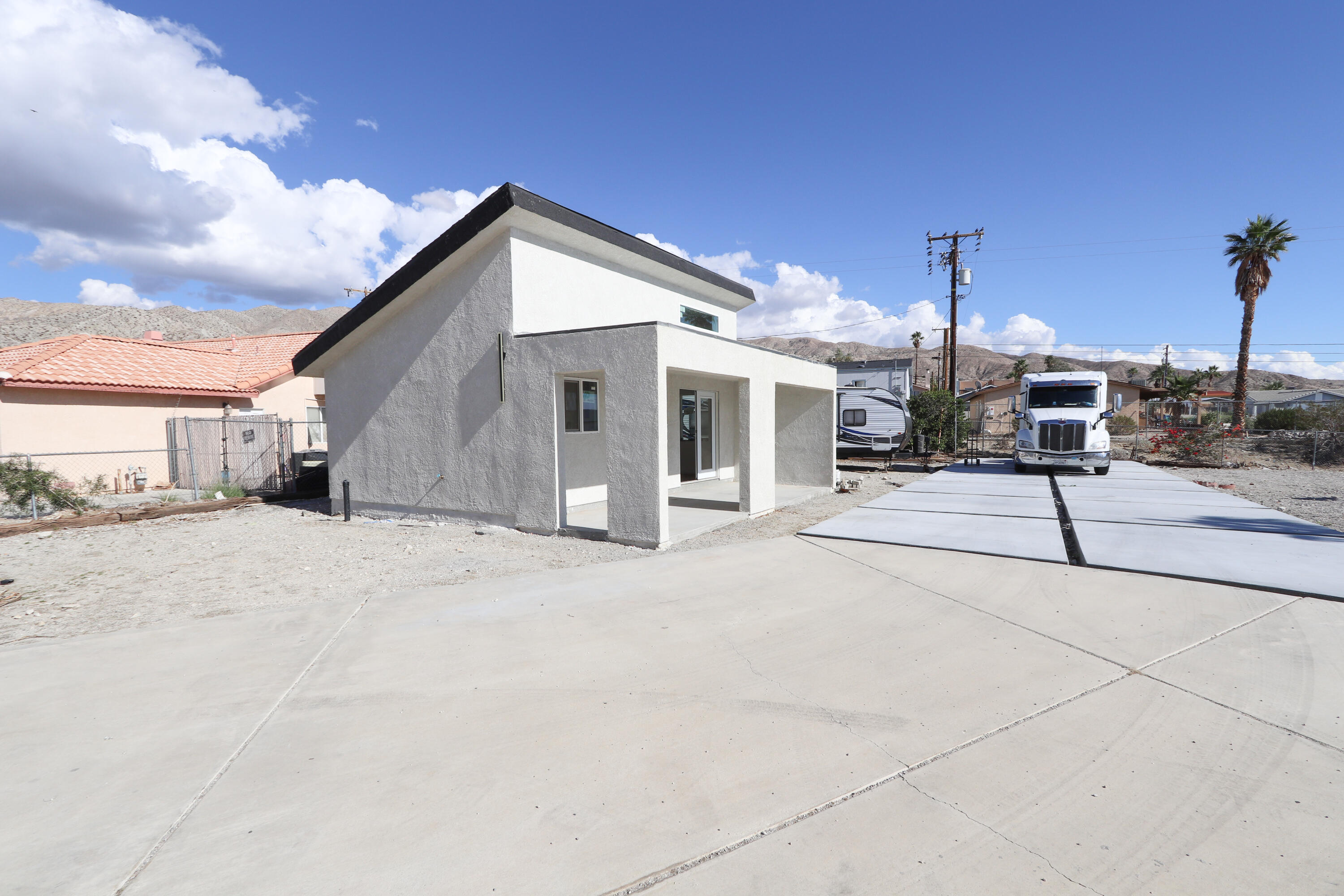 10900 Telimo Way, Unit B Desert Hot Springs, CA 92240 - Photo 3 of 10 a patio with a table and chairs