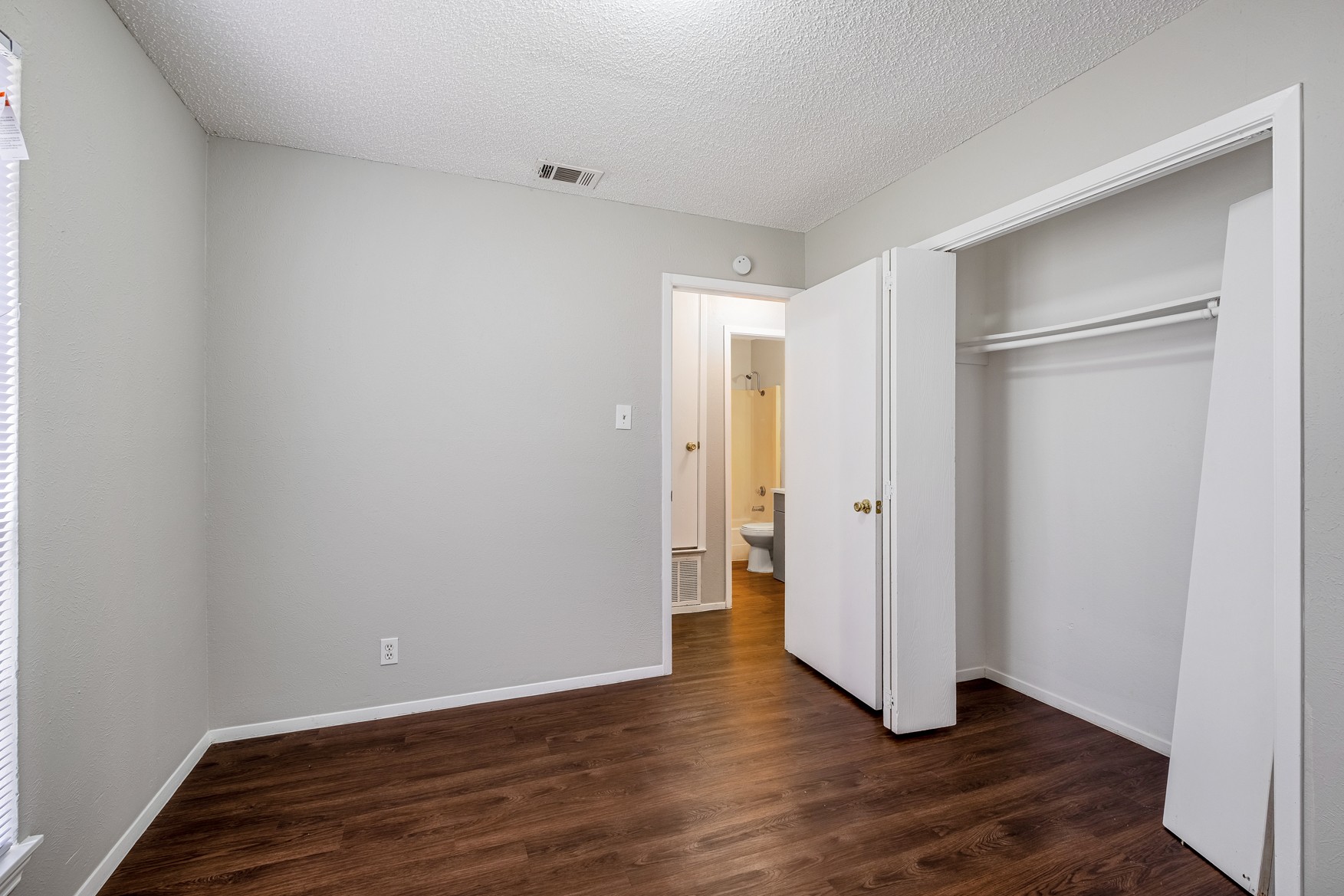 604 Misty Morning Way, Unit B Round Rock, TX 78664 - Photo 12 of 23 a view of an empty room with wooden floor