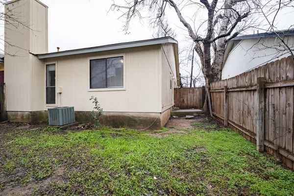 a backyard of a house with lots of green space