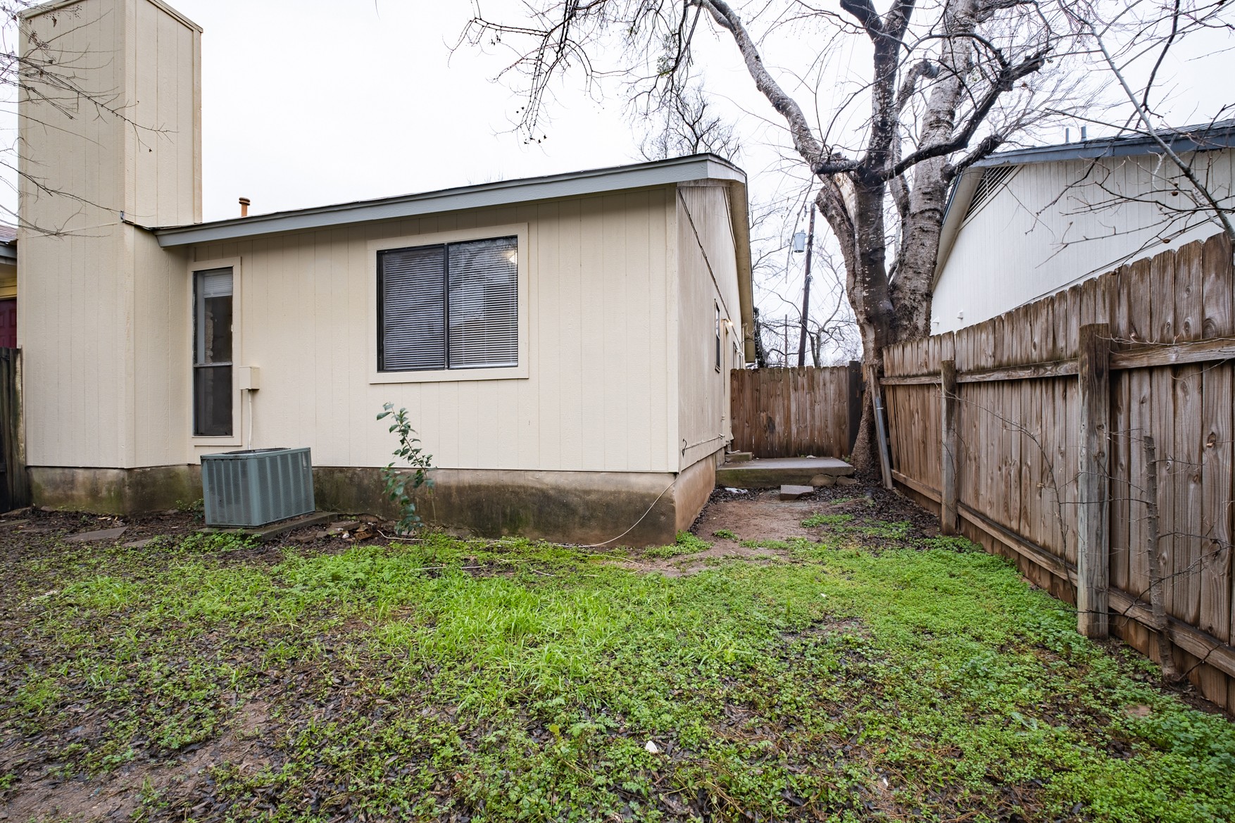 604 Misty Morning Way, Unit B Round Rock, TX 78664 - Photo 17 of 23 a backyard of a house with lots of green space