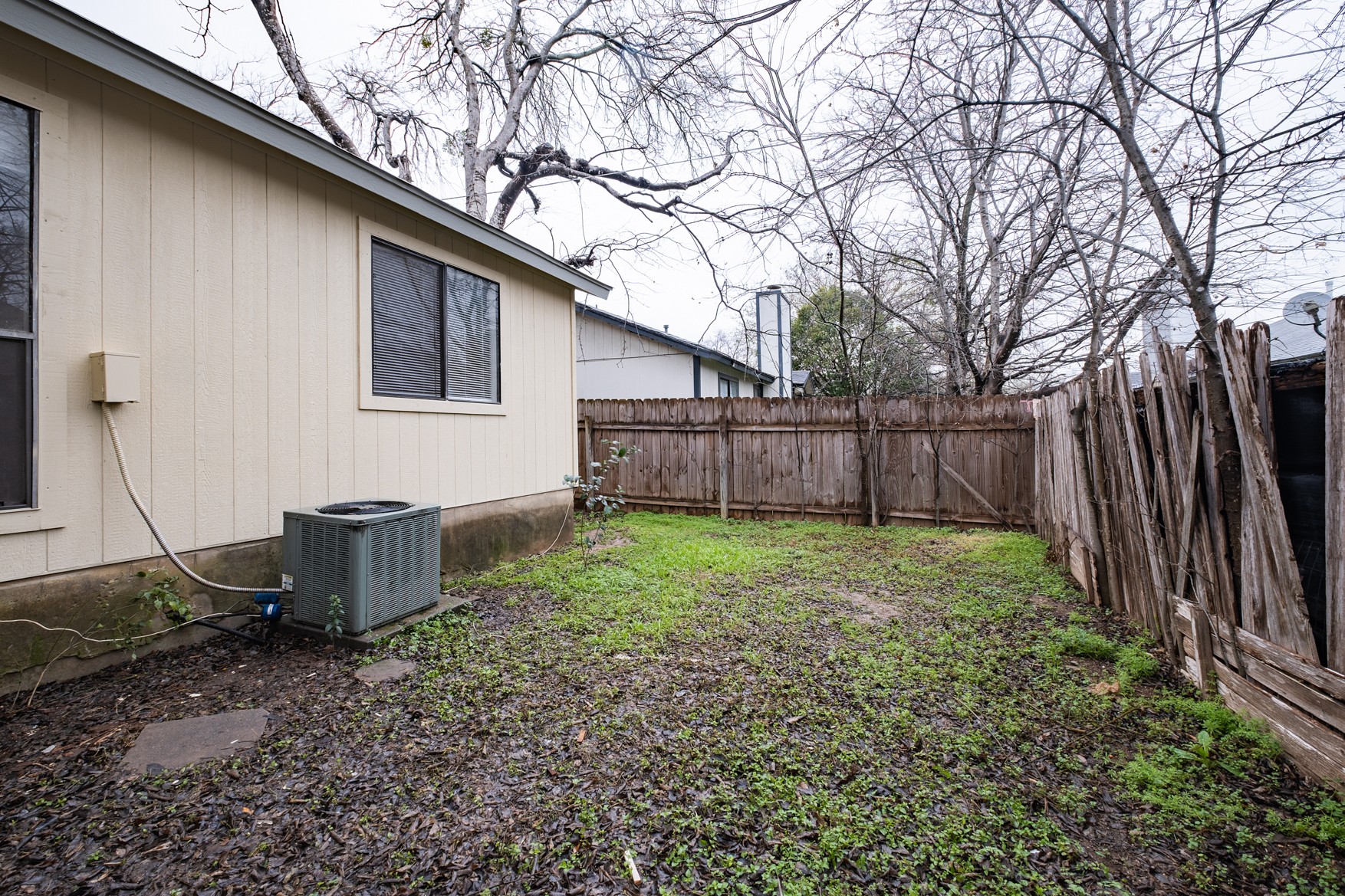 604 Misty Morning Way, Unit B Round Rock, TX 78664 - Photo 19 of 23 a backyard of a house with lots of green space
