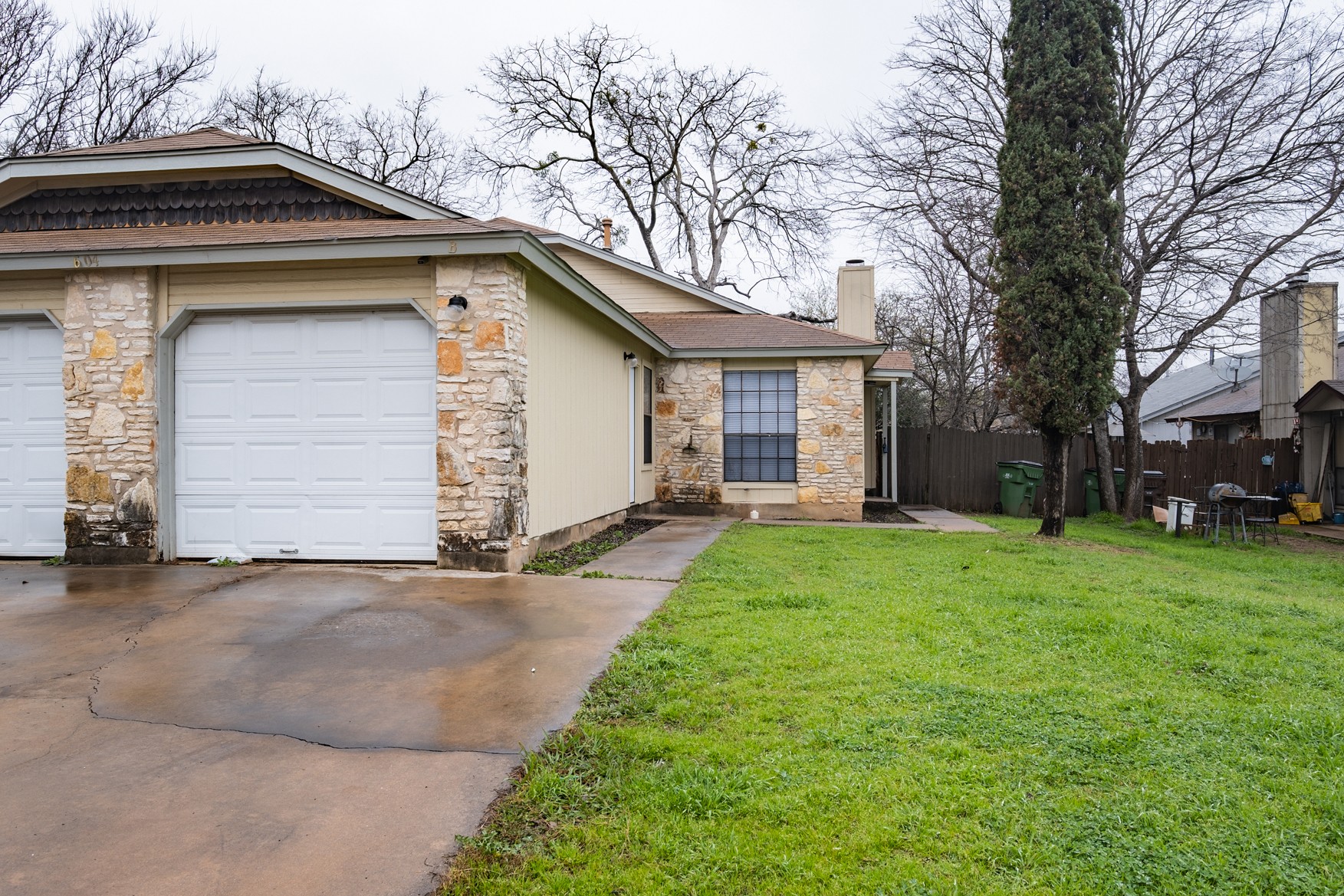 604 Misty Morning Way, Unit B Round Rock, TX 78664 - Photo 22 of 23 a small white house with a outdoor space