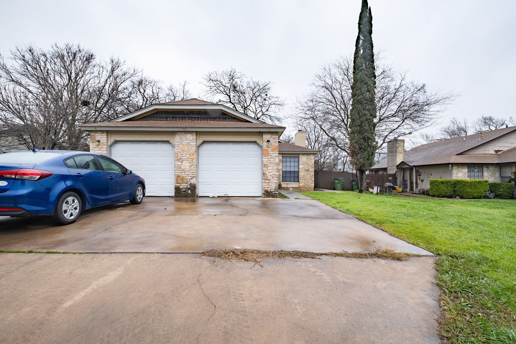 604 Misty Morning Way, Unit B Round Rock, TX 78664 - Photo 23 of 23 a view of a car parked in front of a house