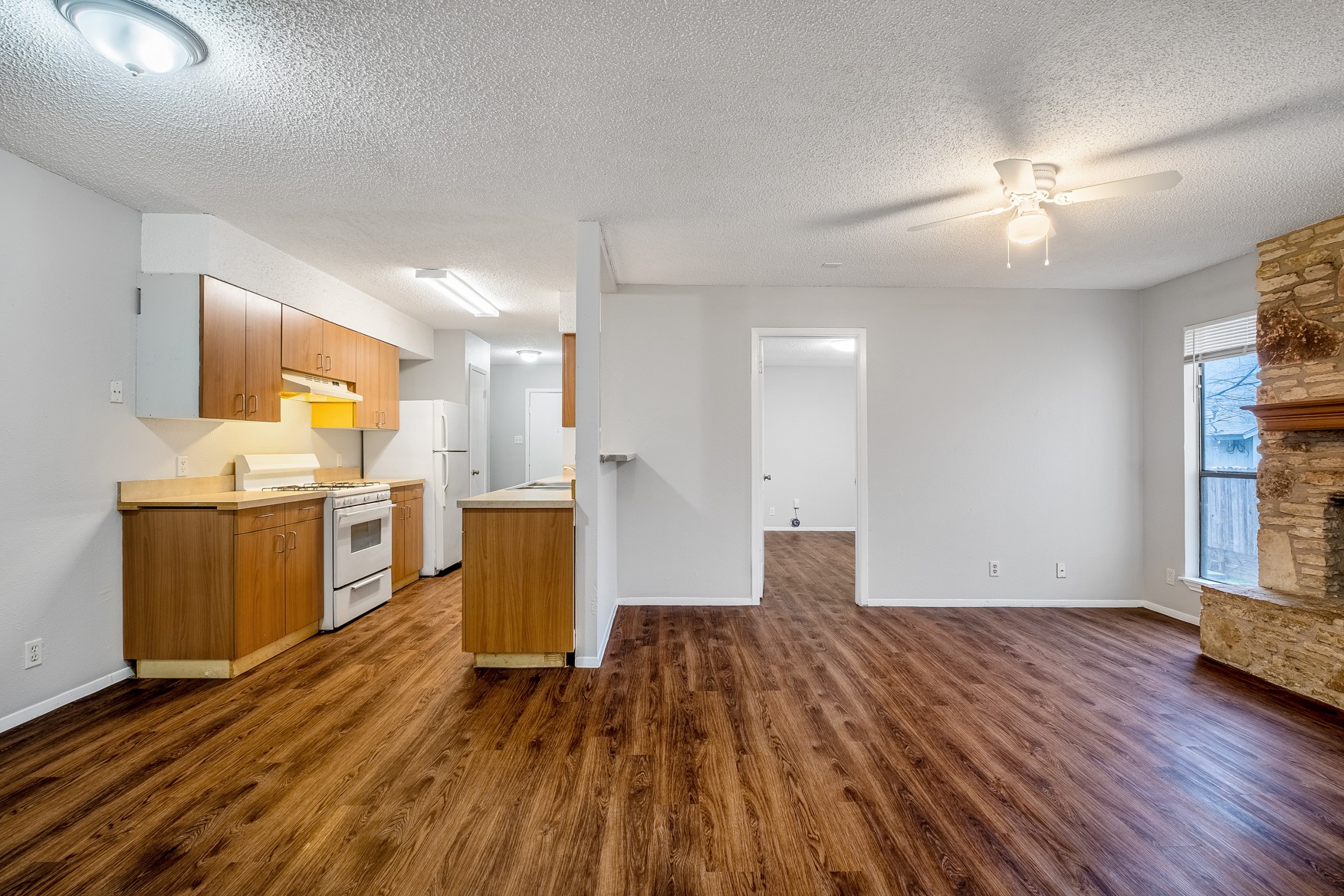 604 Misty Morning Way, Unit B Round Rock, TX 78664 - Photo 4 of 23 a view of a kitchen with wooden floor and a kitchen