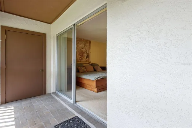 a view of a bedroom with cabinet walk in closet and bedroom
