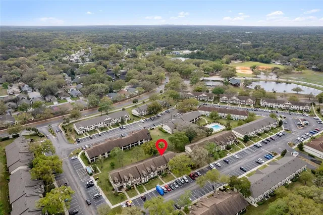 an aerial view of residential houses with outdoor space