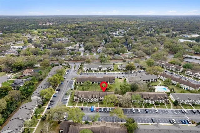 an aerial view of a house with a garden