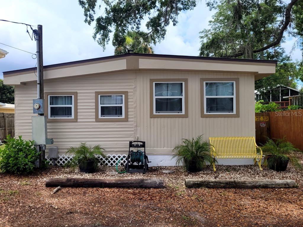 5527 Darlene Street Weeki Wachee, FL 34607 - Photo 1 of 1 a front view of a house with garden