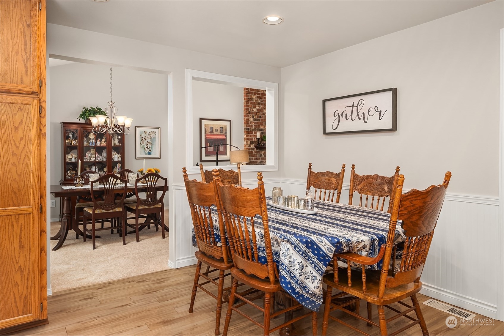 23017 38th Avenue Southeast Bothell, WA 98021 - Photo 14 of 38 a view of a dining room with furniture and wooden floor