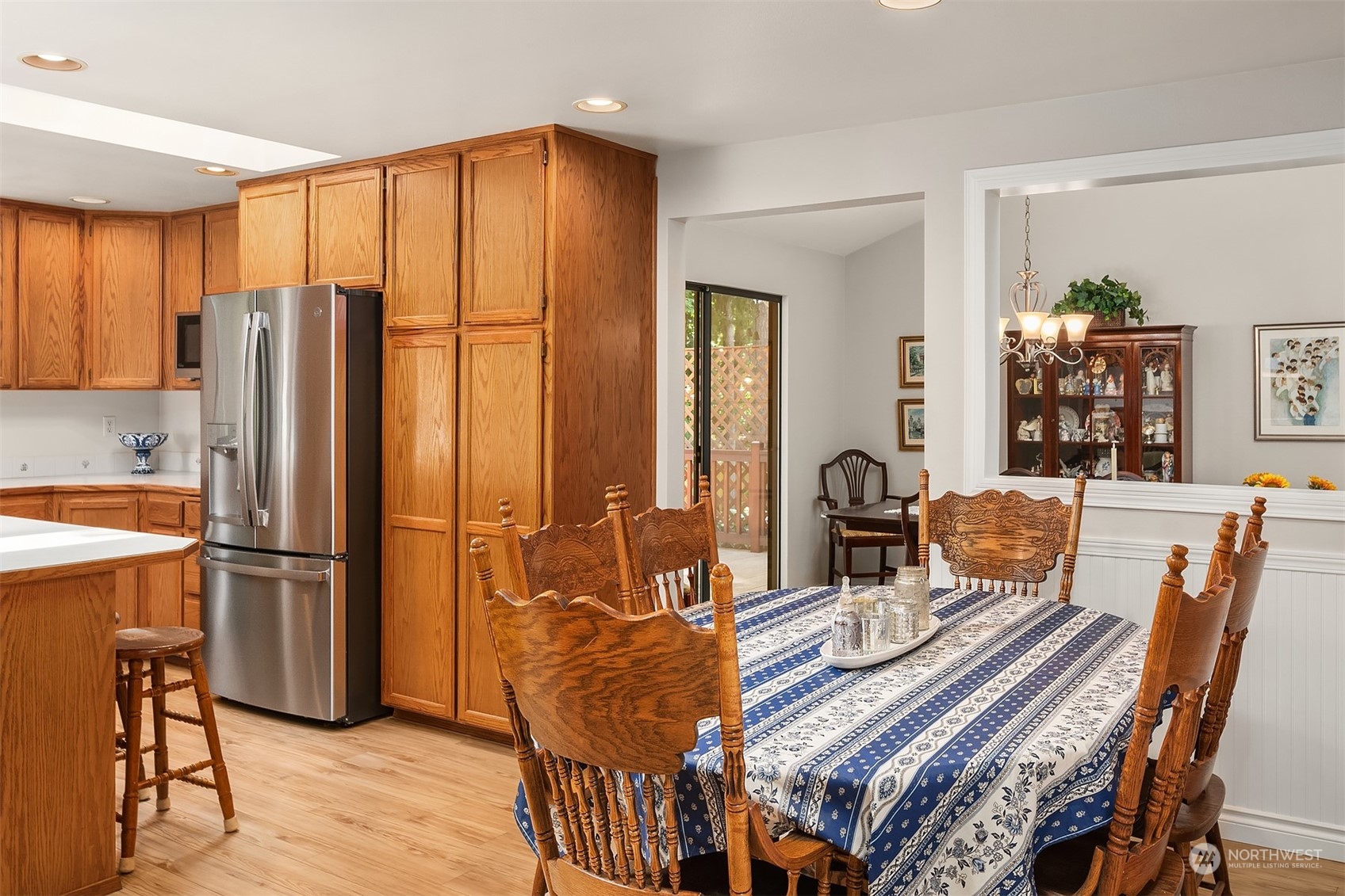 23017 38th Avenue Southeast Bothell, WA 98021 - Photo 15 of 38 a dining room with furniture and wooden floor